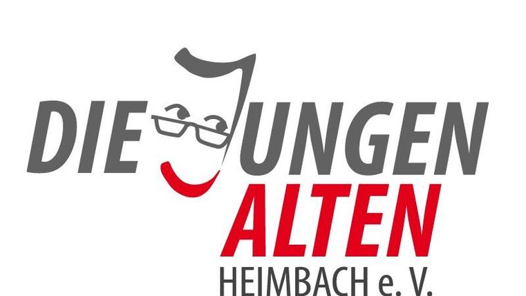 Ein Logo mit dem Schriftzug "Die jungen Alten Heimbach e. V." und einer stilisierten Gesichtsmaske. Das Design wird von einer roten und grauen Farbgebung dominiert.