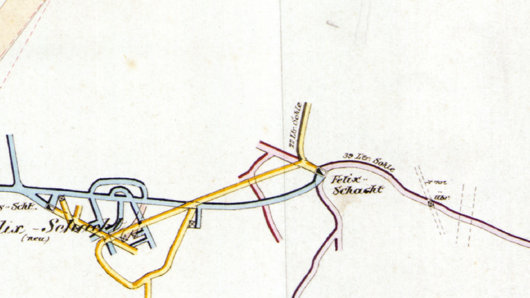 Eine alte Karte mit verschiedenen farbigen Linien, die Straßen und Wege in einem Gebiet darstellen. Die Beschriftungen zeigen den Namen "Fritz-Schubert" und andere Wegpunkte.